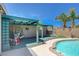 Outdoor patio by the pool for entertainment, featuring shade and lounging areas at 3266 Mountain Spring Rd, Las Vegas, NV 89146