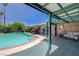 Shaded patio area near the pool, ideal for outdoor entertaining and relaxation at 3266 Mountain Spring Rd, Las Vegas, NV 89146