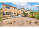 Spacious backyard featuring minimal landscaping, an outdoor seating area, and an expansive area at 3568 Gloucester Gate St, Las Vegas, NV 89122