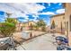 Spacious backyard with a patio area, table and chairs, minimal landscaping, and potential at 3568 Gloucester Gate St, Las Vegas, NV 89122