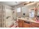 Bathroom featuring tub/shower combo, tile flooring, toilet and sink at 3568 Gloucester Gate St, Las Vegas, NV 89122