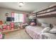 Bright bedroom featuring a charming bunk bed, plush carpeting and ample storage at 3568 Gloucester Gate St, Las Vegas, NV 89122