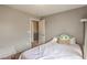 Comfortable bedroom featuring neutral walls, carpeted floors, and a cozy bed with accent pillow at 3568 Gloucester Gate St, Las Vegas, NV 89122