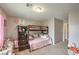 Comfortable bedroom featuring a bunk bed with wood frame, carpeted floors and neutral walls at 3568 Gloucester Gate St, Las Vegas, NV 89122