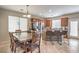 Kitchen and Dining room with stainless steel appliances and an island with barstool seating at 3568 Gloucester Gate St, Las Vegas, NV 89122