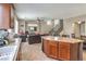 Open concept kitchen and living room area with comfortable seating and plenty of natural light at 3568 Gloucester Gate St, Las Vegas, NV 89122
