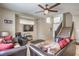 Bright living room featuring tile flooring, a staircase, and ample seating at 3568 Gloucester Gate St, Las Vegas, NV 89122