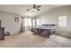Spacious main bedroom with carpet, natural light, ceiling fan, and vaulted ceiling at 3568 Gloucester Gate St, Las Vegas, NV 89122