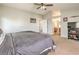 Carpeted main bedroom offering ceiling fan, access to main bath and neutral color scheme at 3568 Gloucester Gate St, Las Vegas, NV 89122