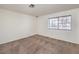 Neutral bedroom with carpet, a window and white painted walls at 3660 Renovah St # 202, Las Vegas, NV 89129
