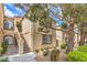 Charming condo building featuring well-maintained landscaping and inviting exterior staircase at 3660 Renovah St # 202, Las Vegas, NV 89129