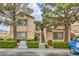 Inviting condo building with manicured landscaping and exterior stairs to upper units at 3660 Renovah St # 202, Las Vegas, NV 89129