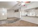 Open living space featuring a tiled entryway, ceiling fan, and seamless access to the kitchen at 3660 Renovah St # 202, Las Vegas, NV 89129