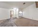 Bright living room with neutral tones, tiled entry, and large arched window at 3660 Renovah St # 202, Las Vegas, NV 89129