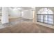 Bright living room featuring a mix of tiled and carpeted floors, with lots of natural light at 3660 Renovah St # 202, Las Vegas, NV 89129