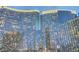 The reflective facade of a high-rise building with lights illuminating the exterior at 3726 S Las Vegas Blvd # 1003, Las Vegas, NV 89158