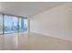 Minimalist living room featuring tile flooring and city views through large window at 3726 S Las Vegas Blvd # 1003, Las Vegas, NV 89158