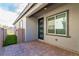 Enclosed back patio shows the door leading to the grassy backyard at 3817 Grazing Gazelle Ave, North Las Vegas, NV 89084