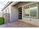 Enclosed back patio shows the door leading to the grassy backyard at 3817 Grazing Gazelle Ave, North Las Vegas, NV 89084