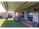 Backyard includes outdoor seating, barbecue, and sliding glass doors at 3817 Grazing Gazelle Ave, North Las Vegas, NV 89084