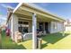 Backyard includes outdoor seating, barbecue, and sliding glass doors at 3817 Grazing Gazelle Ave, North Las Vegas, NV 89084