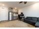 Large bonus room with built-in kitchenette, neutral carpet and convenient access to exterior door at 3817 Grazing Gazelle Ave, North Las Vegas, NV 89084