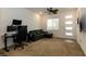 Cozy bonus room, great as an office, with a ceiling fan and bright front door to the home at 3817 Grazing Gazelle Ave, North Las Vegas, NV 89084