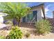 Corner view showing desert landscaping with stone accents, shrubbery, and a home facade at 3817 Grazing Gazelle Ave, North Las Vegas, NV 89084