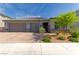 Charming single-story home featuring a three-car garage, desert landscaping, and a welcoming entrance at 3817 Grazing Gazelle Ave, North Las Vegas, NV 89084