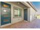 Exterior view of an enclosed back patio with blue painted door at 3817 Grazing Gazelle Ave, North Las Vegas, NV 89084