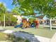 Community playground with slides and shaded area with houses in background at 3817 Grazing Gazelle Ave, North Las Vegas, NV 89084