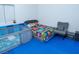 ' bedroom with blue flooring, play area, and vibrant construction-themed bedding at 3934 Palos Verdes St, Las Vegas, NV 89119