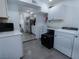 Bright, modern kitchen with white cabinetry, stainless steel appliances, and sleek countertops at 3934 Palos Verdes St, Las Vegas, NV 89119