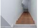 A view of the home's staircase with wood steps and white walls, leading to a door at 3934 Palos Verdes St, Las Vegas, NV 89119