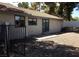 View of the home's exterior with tile roof and fenced backyard at 3948 Applecrest St, Las Vegas, NV 89108