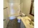 Standard bathroom featuring tile floors, shower-tub combo, toilet, and single sink vanity at 3948 Applecrest St, Las Vegas, NV 89108