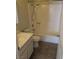 Bright bathroom featuring a shower/tub combo with tile flooring and a single sink vanity at 3948 Applecrest St, Las Vegas, NV 89108
