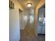 Long hallway features tile flooring that leads to the living area and kitchen at 3948 Applecrest St, Las Vegas, NV 89108