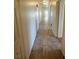 Long hallway features tile flooring with multiple door openings at 3948 Applecrest St, Las Vegas, NV 89108