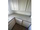 Bright kitchen features white cabinets and countertops and a dishwasher at 3948 Applecrest St, Las Vegas, NV 89108