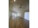 Bright living room with tile flooring, ceiling fan, and sliding glass doors at 3948 Applecrest St, Las Vegas, NV 89108
