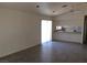 Open concept living space with tile flooring, ceiling fan and sliding doors to the backyard at 3948 Applecrest St, Las Vegas, NV 89108