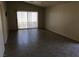 Bright living room with tile floors and sliding glass doors leading to the backyard at 3948 Applecrest St, Las Vegas, NV 89108