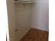 A practical walk-in closet offering shelving and wood flooring for storage needs at 3948 Applecrest St, Las Vegas, NV 89108