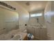 Bathroom features a walk in tub, sink and tile countertops at 4330 Turner Blvd, Pahrump, NV 89061