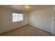 Cozy bedroom with neutral carpet and a bright window at 4330 Turner Blvd, Pahrump, NV 89061