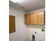 Functional laundry room with cabinets and essential hookups at 4330 Turner Blvd, Pahrump, NV 89061