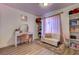Cozy bedroom featuring a vanity area, plush seating, and stylish decor at 4428 Ash Ave, Las Vegas, NV 89110