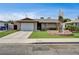 Charming single-story home with a well-maintained front yard and a driveway leading to a single car garage at 4428 Ash Ave, Las Vegas, NV 89110