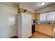 Functional kitchen featuring wooden cabinets and updated appliances, including a dishwasher at 4428 Ash Ave, Las Vegas, NV 89110